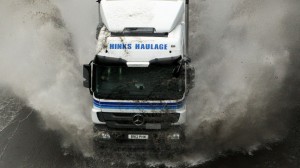 169900-lorry-in-flooded-motorway-road-illustrating-flooding-weather-rain-bad-weather-transport-cars-o