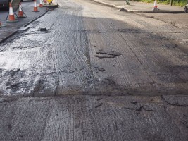 Paving works to remove and lay new tarmac asphalt on a road