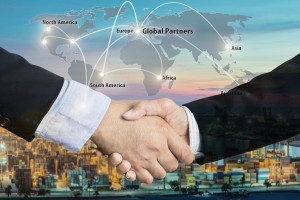 Double Exposure of a businessman handshake  with Map global partner connection of Container Cargo freight ship for Logistic Import Export background (Elements of this image furnished by NASA)